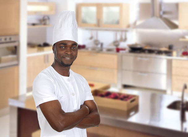 Attractive chef in the cuisine - Photo, Image