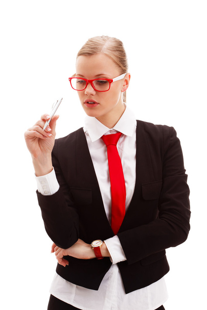 Seriously businesswoman holding pen - Foto, imagen
