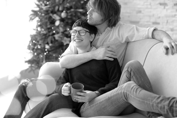 Cute young couple spending time together indoors, black and white effect - Foto, Imagem