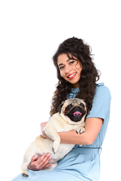 beautiful young woman holding adorable pug isolated on white - Fotografie, Obrázek