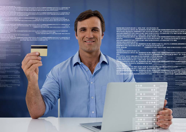 Digital composite of Businessman working on laptop with screen text interface - Foto, imagen