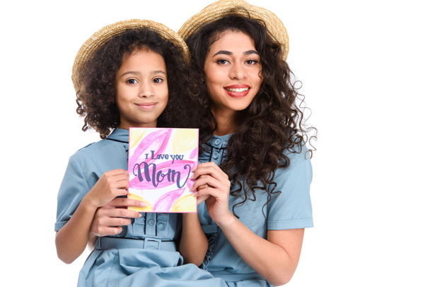 happy mother and daughter with mothers day greeting card looking at camera isolated on white - Photo, Image