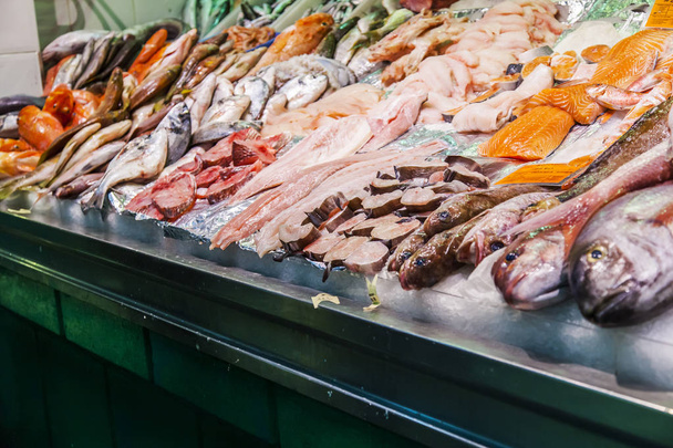 Las-Palmas de Gran Canaria, Spain, on January 12, 2018. Fresh fish and seafood are laid out on a show-window of shop in the central market - Valokuva, kuva