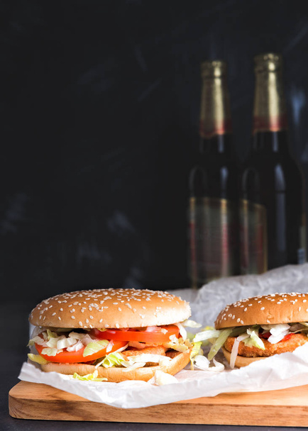 Chiken burgers and bottles of Beer. - Photo, Image