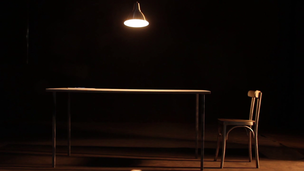 Lamp dangling over table - Footage, Video