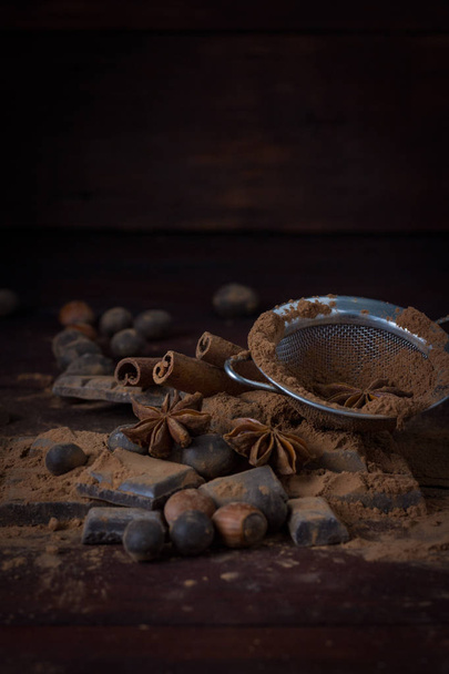 Chocolate, Spices, Spoon with Cocoa, Metal Strainer, Hazelnut on - 写真・画像