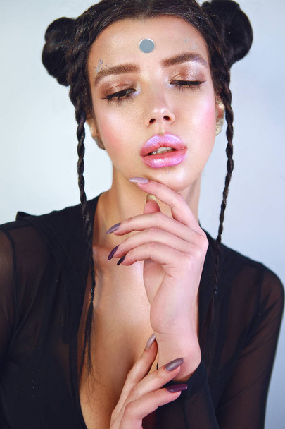 Close-up portrait of attractive model with big lips, shiny make-up and braids - Foto, Imagem