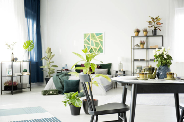 Table in multifunctional bedroom interior - Fotografie, Obrázek
