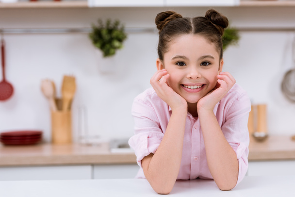adorable little child at kitchen looking at camera - Photo, image