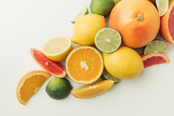 Assorted juicy citruses isolated on white background - Photo, Image