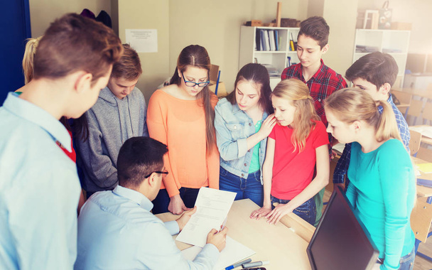 group of students and teacher with tests at school - Fotografie, Obrázek