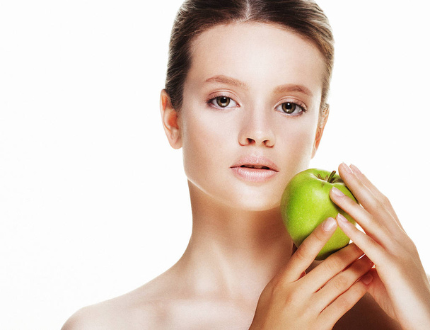 Young  woman with green apple, isolated on white background - Zdjęcie, obraz