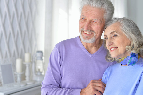 portrait of a happy senior couple hugging  at home - Фото, изображение
