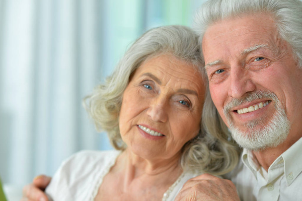 Close-up portrait of a happy senior couple at home - Фото, изображение