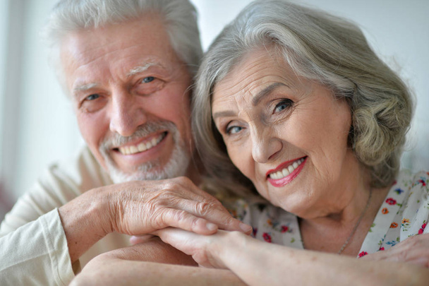 Close-up portrait of a happy senior couple at home - Фото, изображение