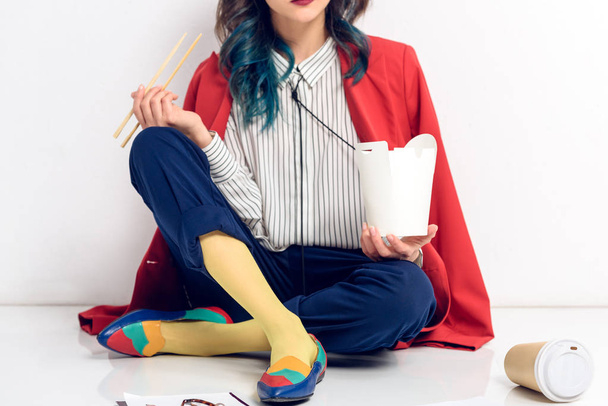 Cropped view of woman eating Chinese food on white background - Fotó, kép