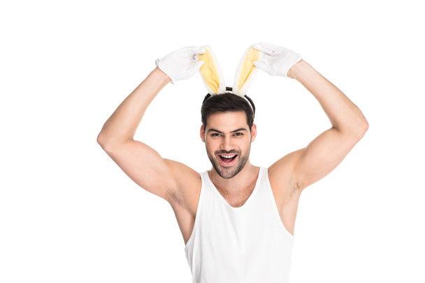 Smiling man with bunny ears isolated on white, easter concept - Fotó, kép