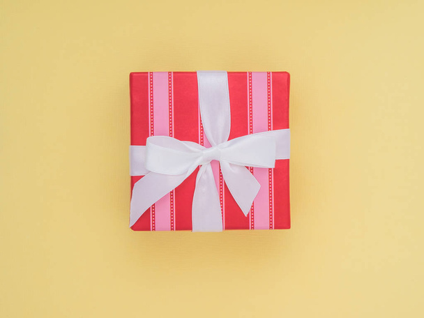 Wrapped gift box. Pastel Colour flat lay minimal concept. Lime punch. - Fotó, kép