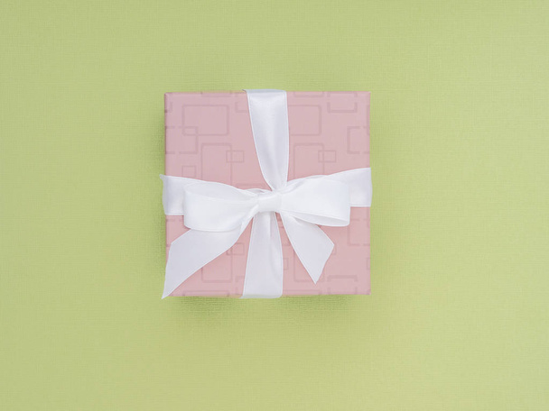 Wrapped gift box. Pastel Colour flat lay minimal concept. - Photo, image