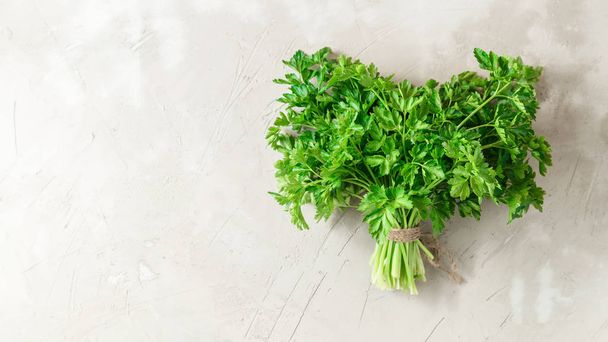 Bunch of parsley on grey concrete background - Foto, Imagen