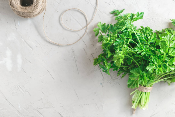 Bunch of parsley on grey concrete background - Foto, immagini