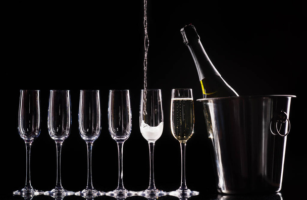 Champagne glasses set on black background - Fotó, kép
