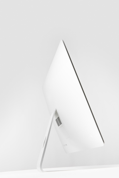 side view of desktop computer display on white  - Photo, Image