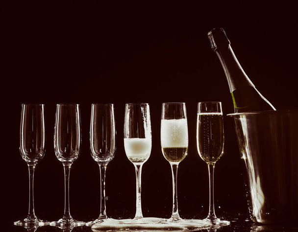 Champagne glasses set on black background - Fotoğraf, Görsel