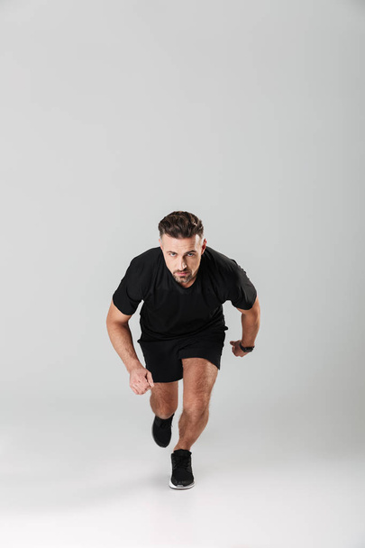 Portrait of a healthy mature sportsman running - Photo, image