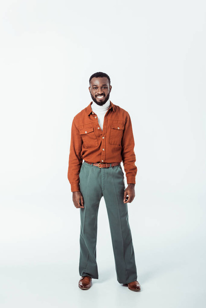 smiling african american retro styled man looking at camera on white - Foto, afbeelding