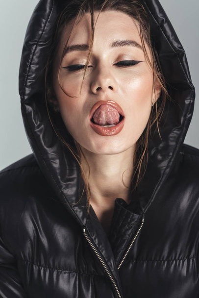 Sexy fashion young stylish woman licking her lips. - Zdjęcie, obraz