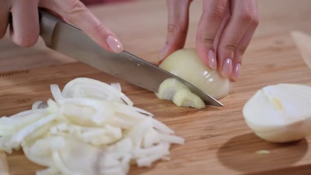 Chef slices the onion. Knife, cutting Board, onion. - Footage, Video