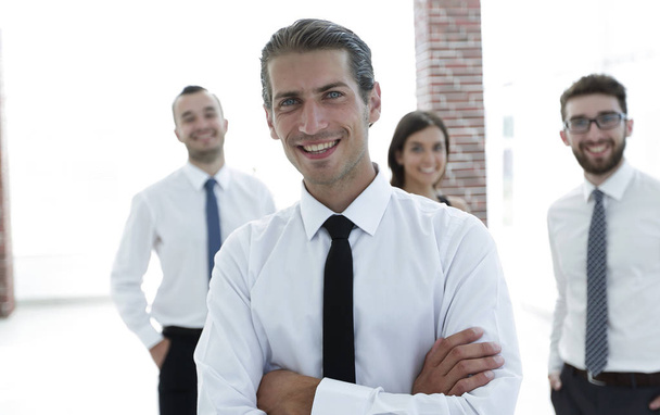 portrait of a successful business person on the background of colleagues. - Fotó, kép