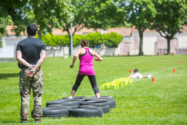 crossfit session outdoors with coach - Foto, Imagen