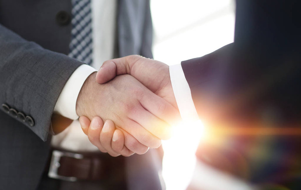 Businessman giving his hand for handshake to partner - Фото, зображення