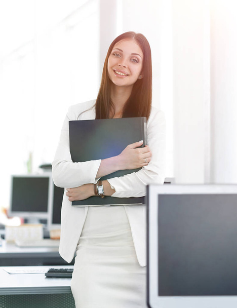 female assistant with documents standing in the office.photo wit - Фото, изображение