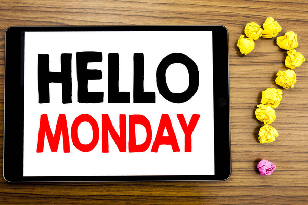 Writing text showing Hello Monday. Business concept for Day Week Start written on tablet computer on the wooden background with question mark made of folded paper. - Photo, Image