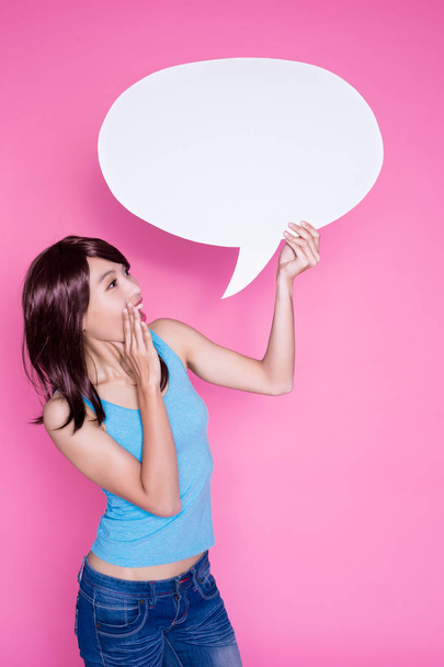 woman holding  speech bubble on the pink background - 写真・画像