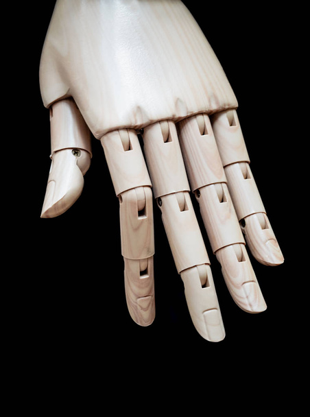 Close up of hand wooden dummy model on black background. - Φωτογραφία, εικόνα