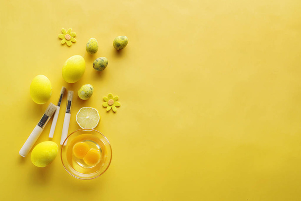 Layout of eggs on a pastel yellow background. Easter concept. Top view. Flat lay. - Fotó, kép