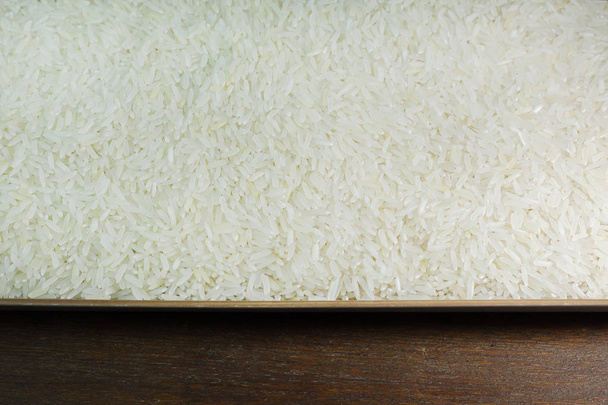 rice grain  on wood table image for background. - Photo, Image