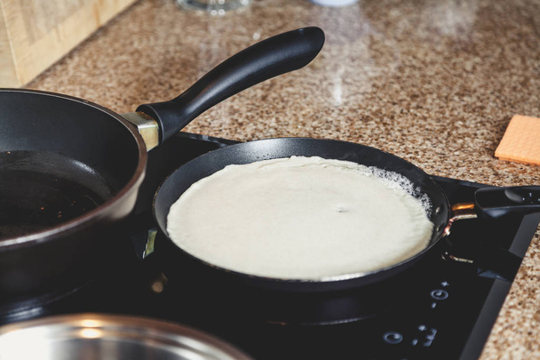 White pancake fry in  pan - Фото, изображение