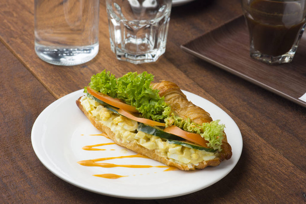 egg sandwich and coffee on white plate  - Photo, image