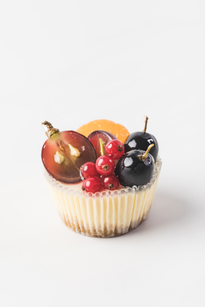 close up view of sweet cupcake with berries and fruits isolated on white - Φωτογραφία, εικόνα