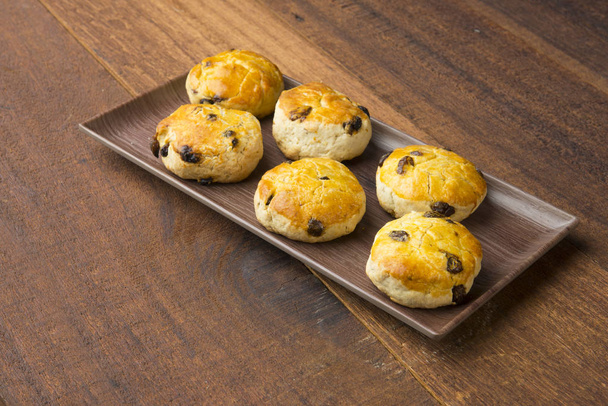 baked scones biscuits on wooden background - Photo, image