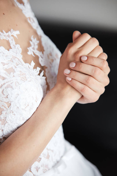 Bride's beautiful side with hands in wedding dress - Photo, Image