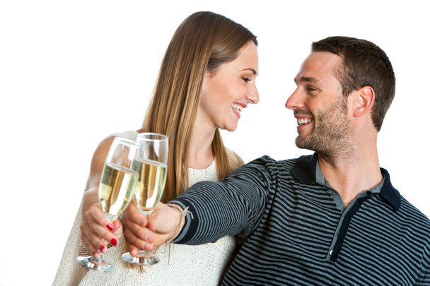 Cute couple making a toast with champagne. - 写真・画像