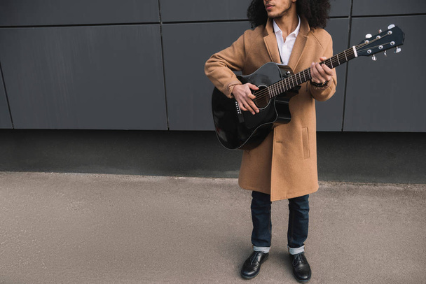 cropped shot of street musician playing guitar outdoors - Zdjęcie, obraz
