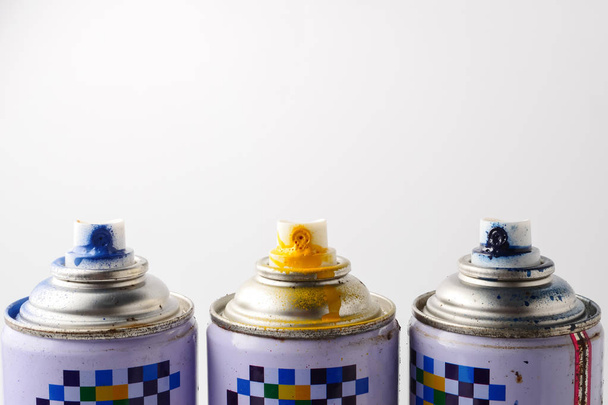 Used cans of spray paint on a white background, Close up, Free space for text. - Photo, Image