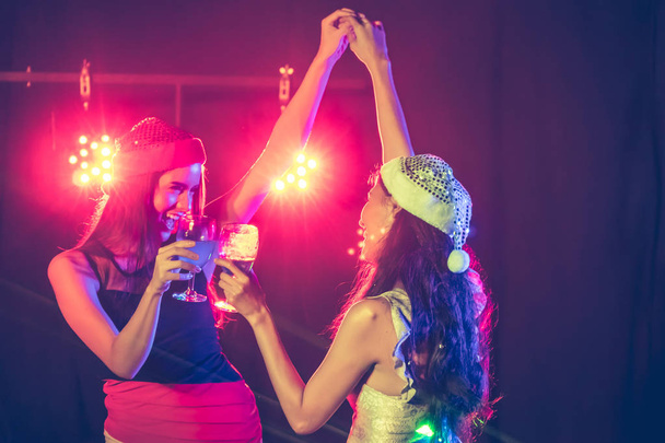 new year party, holidays, celebration, nightlife and people concept - Beautiful girls having fun at a party. - Foto, imagen